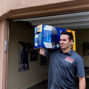 A guy carrying a garage door opener